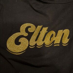 Elton John Black Glittery Gold Scripted Graphic Tee✨